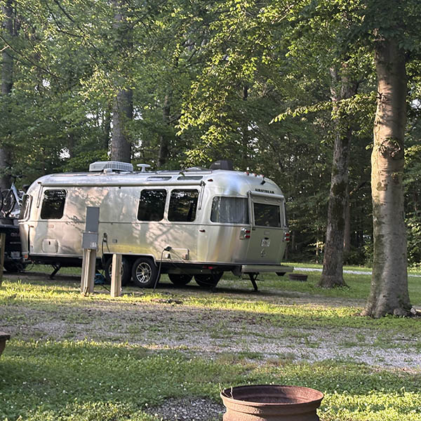 Wooded RV Site at Woods-N-Waters Campground Airstream camper on a shaded wooded RV site at Woods-N-Waters Campground in Columbus, Indiana
